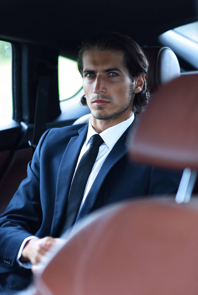 businessman sitting in a comfortable car - Photo, Image
