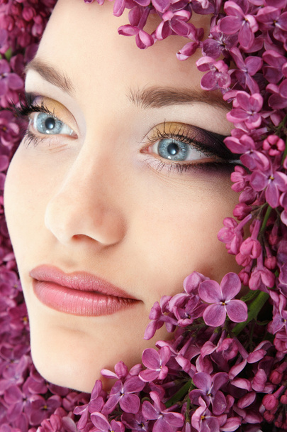 woman beautiful face with flower lilac - Photo, Image