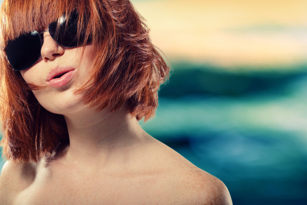 Summer teen girl redhaired cheerful in sunglasses - Fotografie, Obrázek