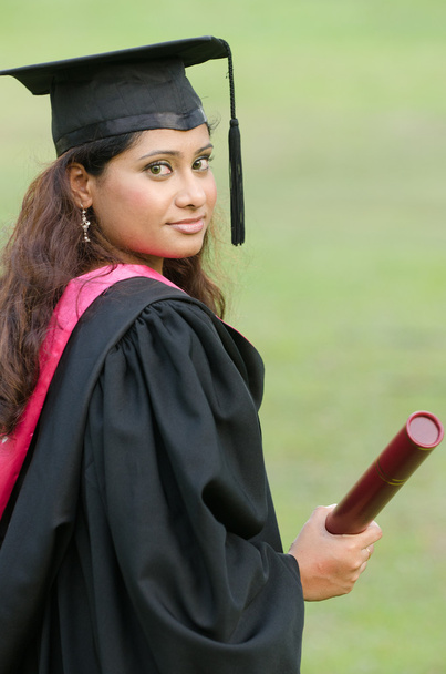 indian female graduate with green background - Fotoğraf, Görsel