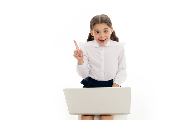 Inspiring idea. Schoolgirl work play laptop isolated on white. Child got inspiration while surfing internet. Inspiring technology concept. Online education and modern schooling. Inspired pupil study - Valokuva, kuva