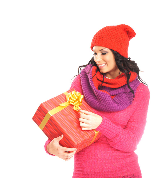 Young and beautiful woman holding a nice Christmas present over - Zdjęcie, obraz