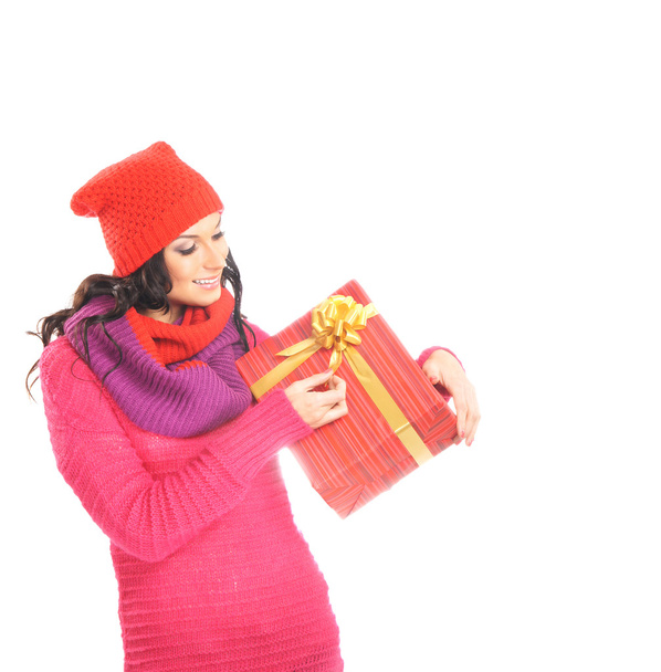 Young and beautiful woman holding a nice Christmas present over - Photo, Image