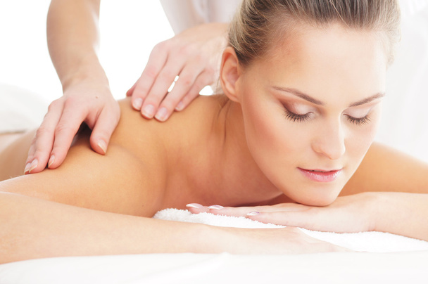 Young attractive woman getting massaging treatment - Fotografie, Obrázek
