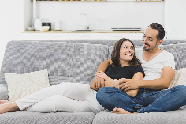 happy mature couple sitting on couch at home and relaxing togetherness. - Foto, immagini