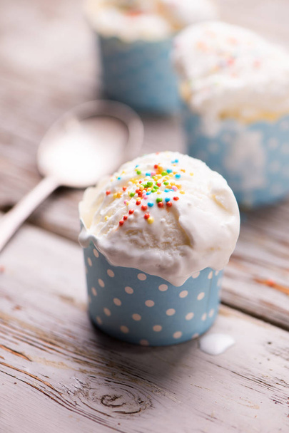 Soft delicious vanila icecream on a table - Zdjęcie, obraz