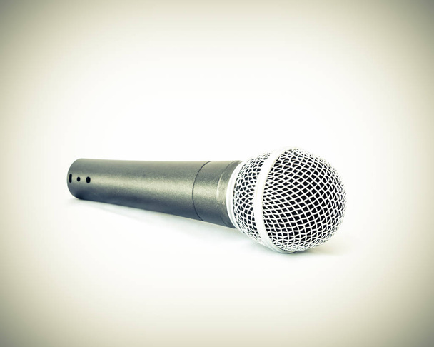 Vintage tone studio shot close-up view a silver black wireless microphone isolated on white background. Vintage filter look. Clipping path and copy space - Photo, Image