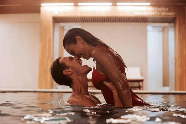 Couple in love at luxury Hotel Spa and pool - Фото, зображення