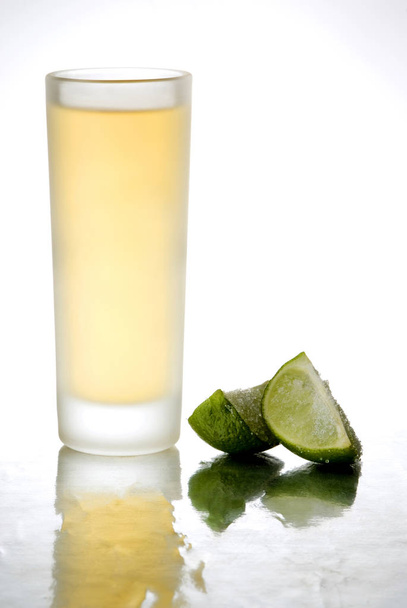 Tequila shot in a mirror isolated on white background - Photo, image