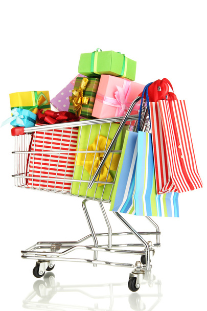 Christmas gifts and shopping in trolley isolated on white - Foto, Imagen
