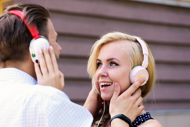 Couple in love listening music in headphones. - Фото, зображення