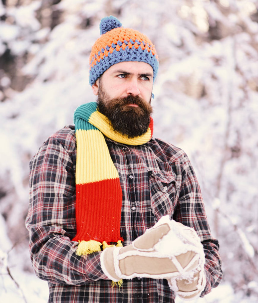 Macho with beard and mustache plays with snowball - Fotoğraf, Görsel