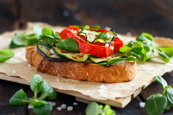 Vegetarian sandwich with fresh cheese, grilled tomatoes, eggplants and zucchini  - 写真・画像