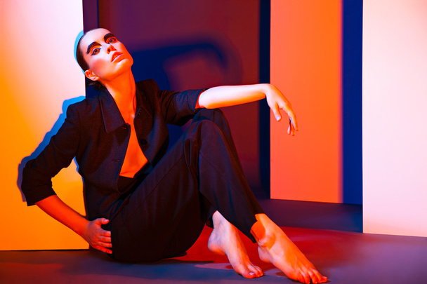 Fashion Portrait of woman over colorful background - Valokuva, kuva