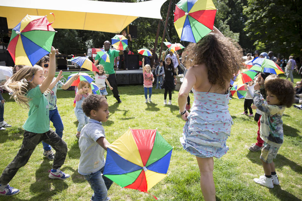 Amsterdam, The Netherlands - July, 3 2016: dance workshop with children at Amsterdam Roots Open Air, free public cultural festival held in Oosterpark - 写真・画像