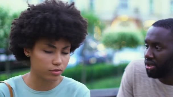 Young afro-american couple arguing outdoors, lies in relationships, breakup - Felvétel, videó