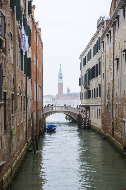 View on San Giorgio Maggiore Church tower bell from small romantic canal Rio Del Vin, Venice, Italy - Photo, Image