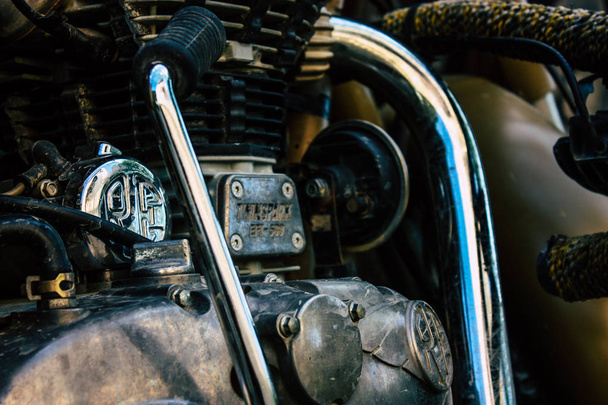 Pokhara Nepal September 18, 2018 Closeup of a Royal Enfield motorcycle parked in the street of Pokhara in the afternoon - Foto, Imagen
