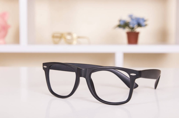 stylish black glasses on table  - Foto, imagen