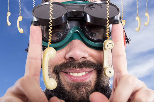 Guy making funny facial expressions and wearing welding goggles - Foto, Bild
