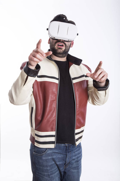 surprised man wearing VR glasses, virtual reality simulation - Photo, image