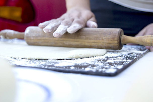 close up of person preparing pizza dough - Photo, Image