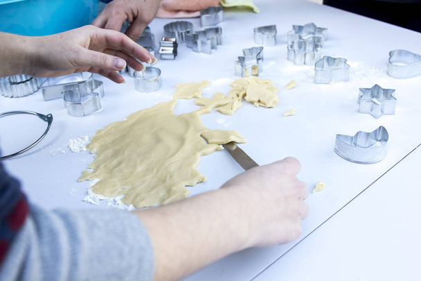 close up of person preparing dough for cookies , Aluminium Christmas Cookie Cutters - 写真・画像