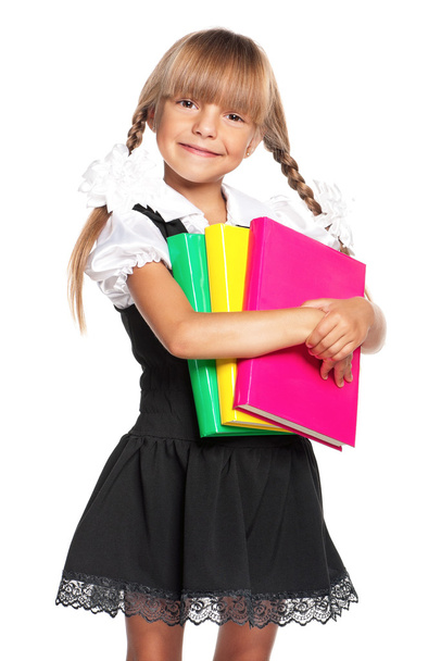 Little girl with books - Фото, изображение
