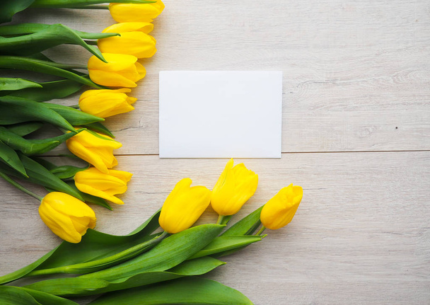Fresh yellow tulips on wooden background - Photo, Image