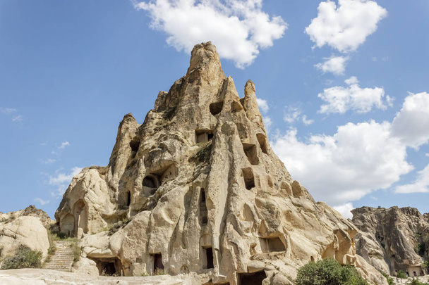 Fairy tale chimneys in Cappadocia with blue sky on background in Goreme,Nevsehir, Turkey - Photo, Image
