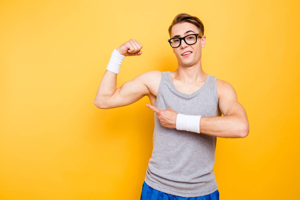 Did you see it Portrait of funny youngster man show biceps on h - 写真・画像
