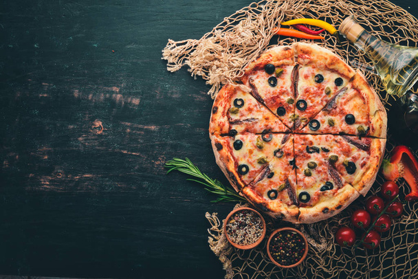Seafood Pizza. Italian cuisine. On a wooden background. Free space for text. Top view. - Foto, Imagem