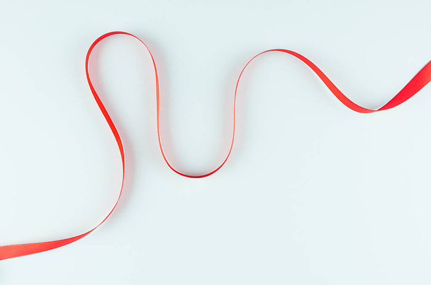 Red smooth love line on pastel mint background. Abstract elegant minimalist backdrop. - Foto, Imagem