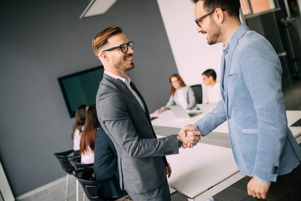 Business people shaking hands, finishing up successful meeting - Фото, зображення