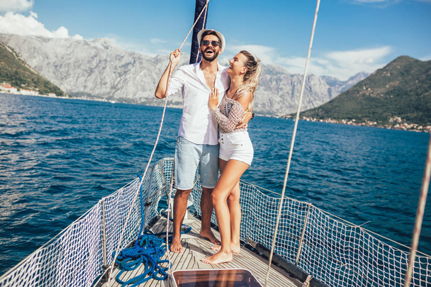Couple in love on a sail boat in the summer. - Foto, Imagem