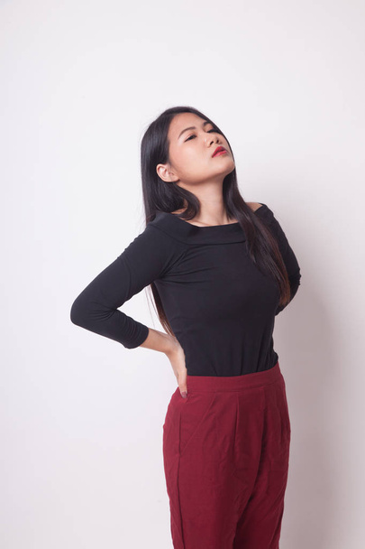 Young Asian woman got back pain on white background - Fotografie, Obrázek