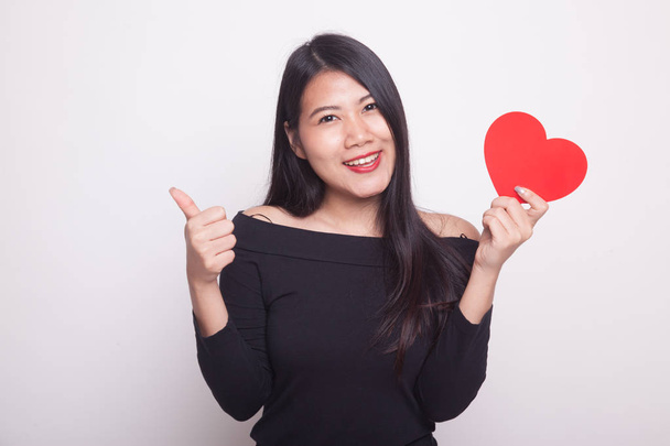 Asian woman thumbs up with red heart on white background - Foto, imagen