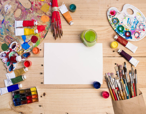 Paints, brushes  on the wood background. The workplace of the artist. Banner for school.  - Fotoğraf, Görsel