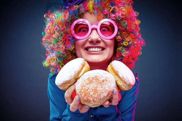 happy woman wearing color wig with party items - Фото, изображение