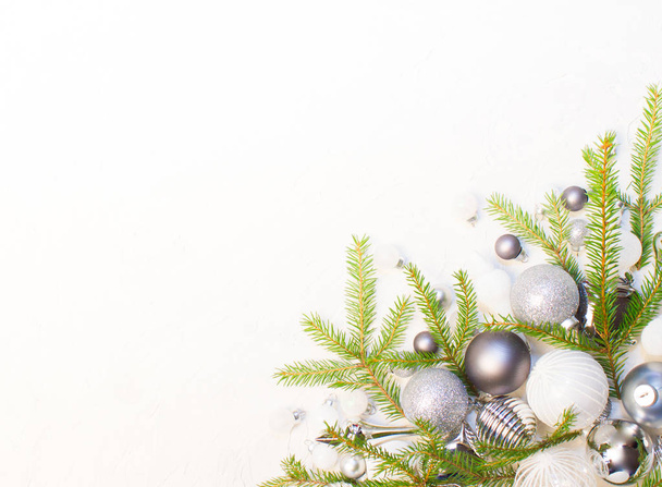Christmas or New Year background: fir tree branches, glass balls, decorations. Place for your congratulations. - Fotó, kép