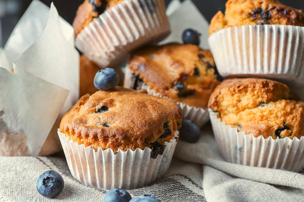 Tasty blueberry muffins on napkin, closeup - Photo, Image