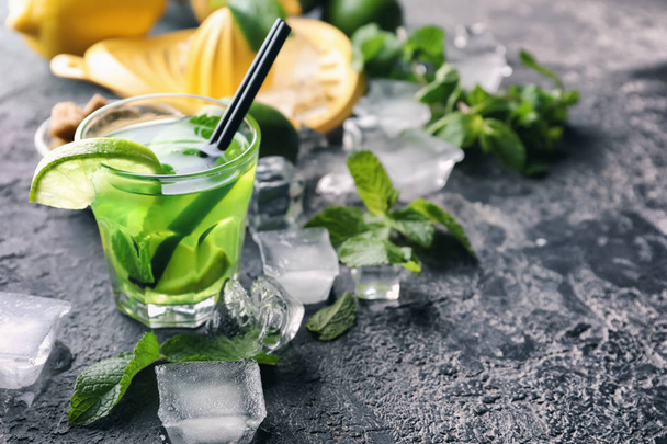 Glass of fresh mojito on table - 写真・画像