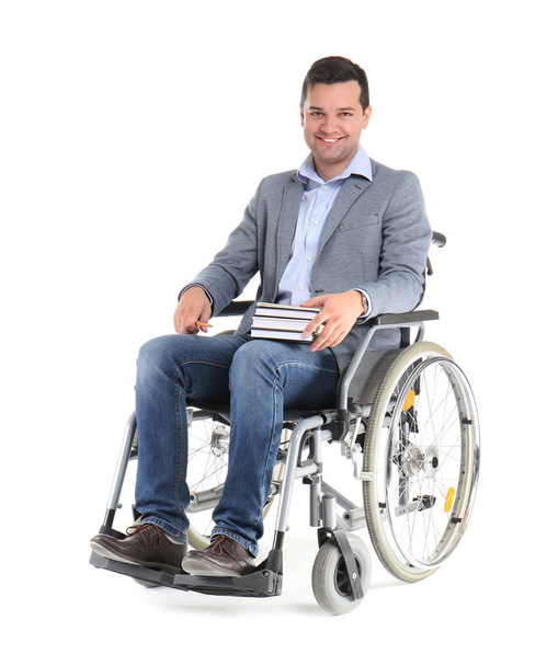 Profesor masculino en silla de ruedas con libros sobre fondo blanco
 - Foto, imagen