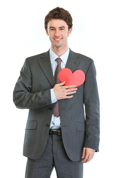 Modern man in business suit with heart shaped postcard - Valokuva, kuva