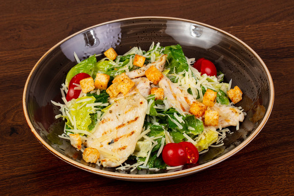 Caesar salad with chicken and cheese - Photo, Image