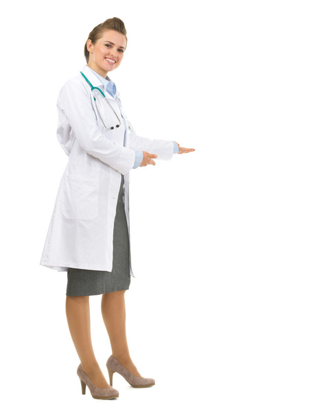 Full length portrait of medical doctor woman inviting to come - Foto, immagini