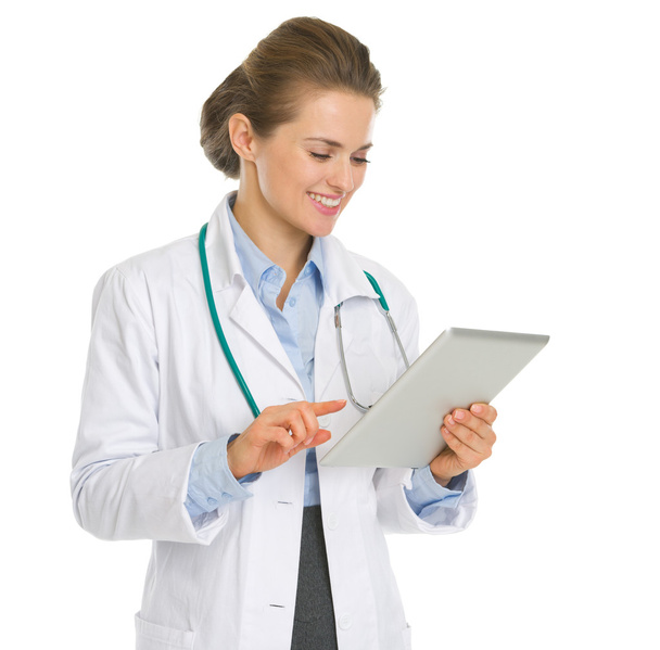 Happy medical doctor woman using tablet PC - Foto, Imagen