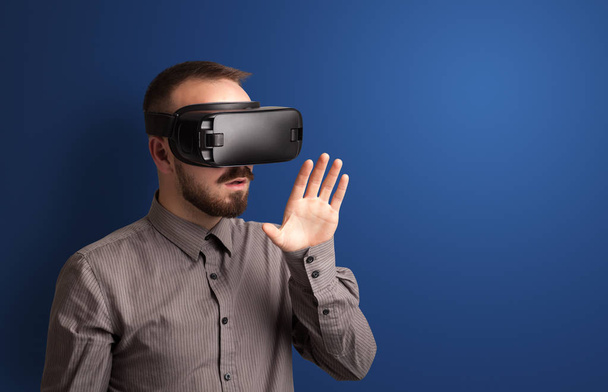 Businessman with virtual reality goggles - 写真・画像