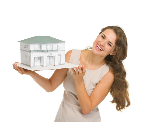 Woman landlord with scale model of house - Valokuva, kuva