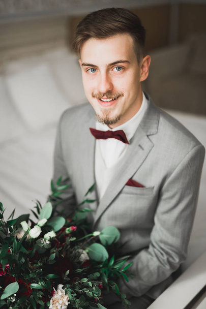 Beautiful man, groom posing and preparing for wedding - Foto, Imagem